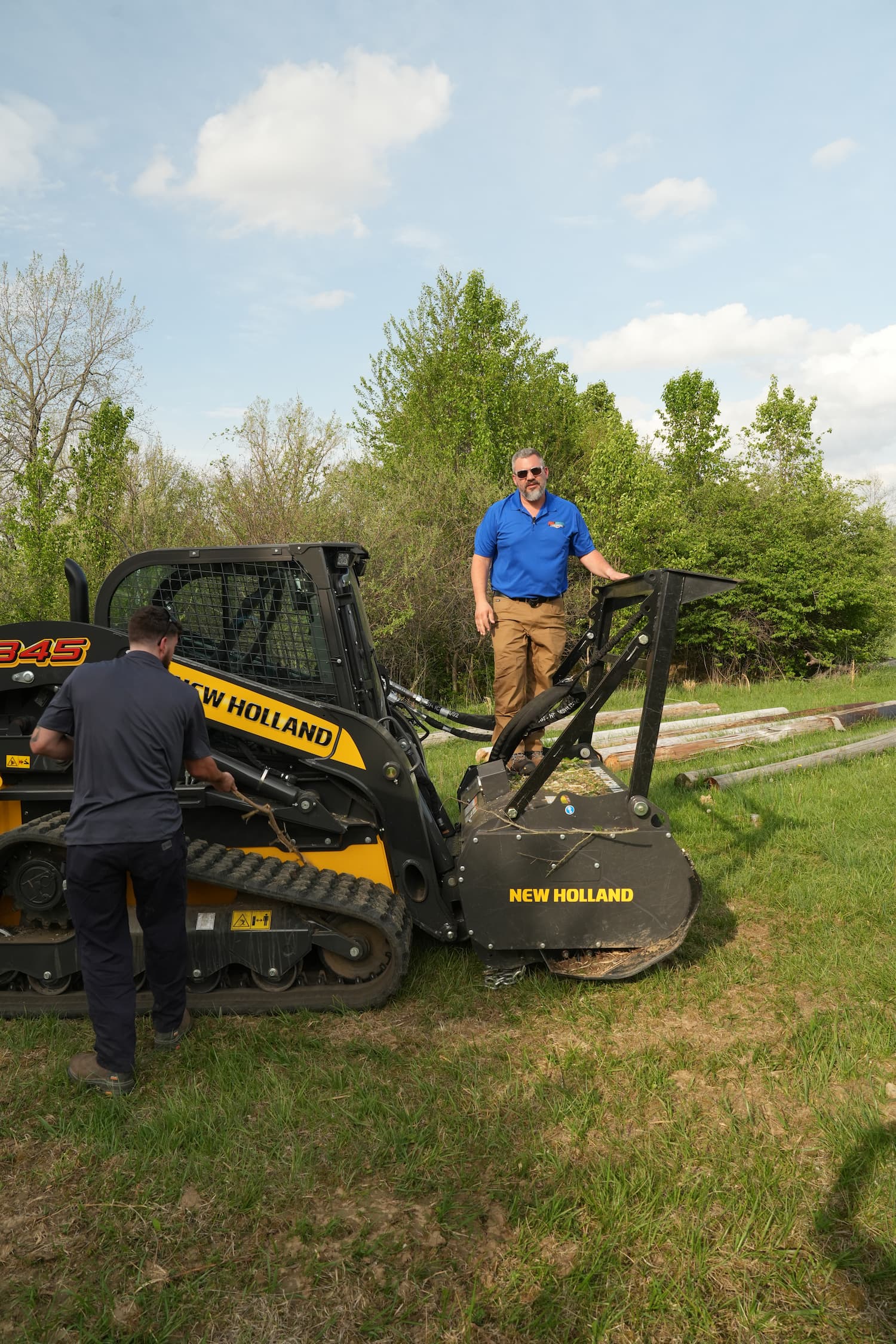 New Holland C345 clearing vegetation Dayton OH — Full Armor